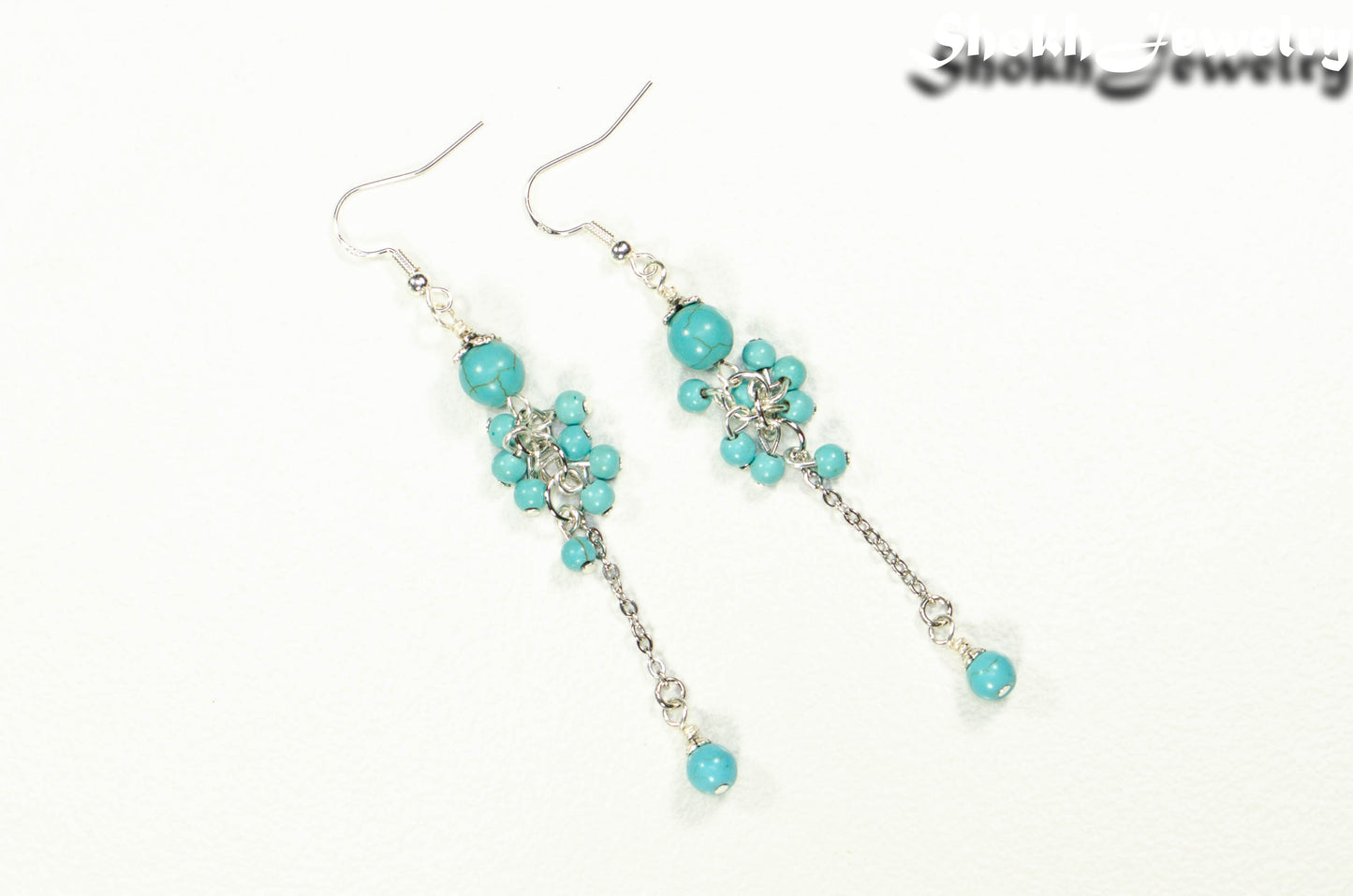 Top view of Long Stainless Steel Chain and Turquoise Howlite Earrings.