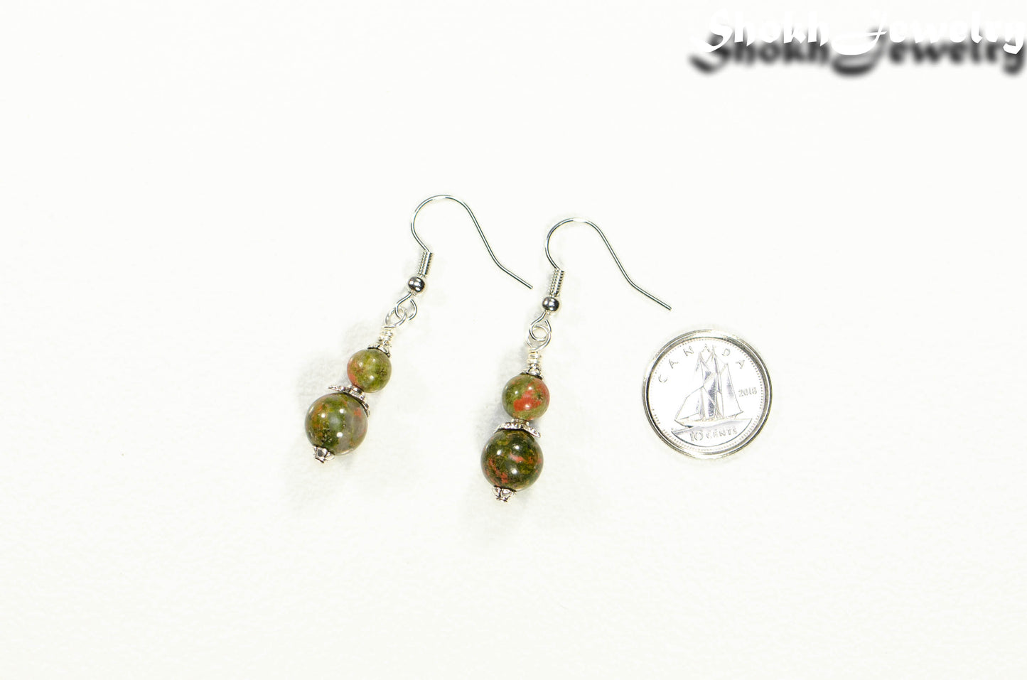 Small Unakite Jasper Earrings beside a dime