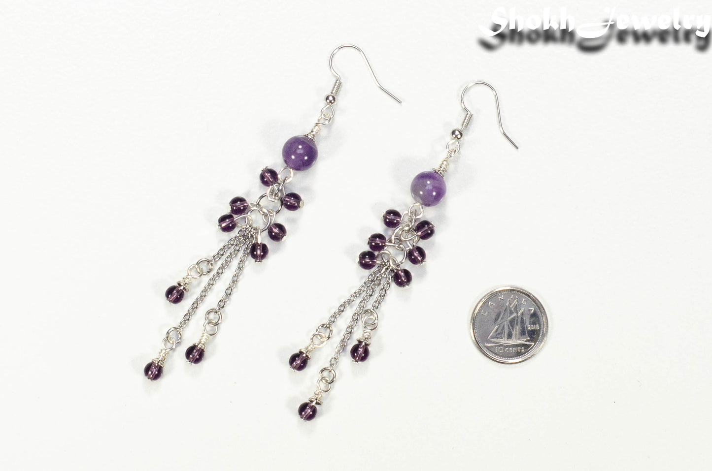 Long Stainless Steel Chain and Amethyst Earrings beside a dime.