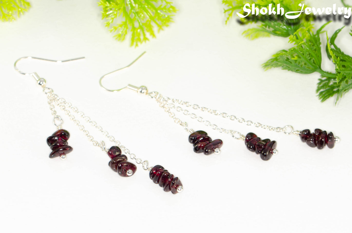 Close up of Long Silver Plated Chain and Garnet Crystal Chip Earrings