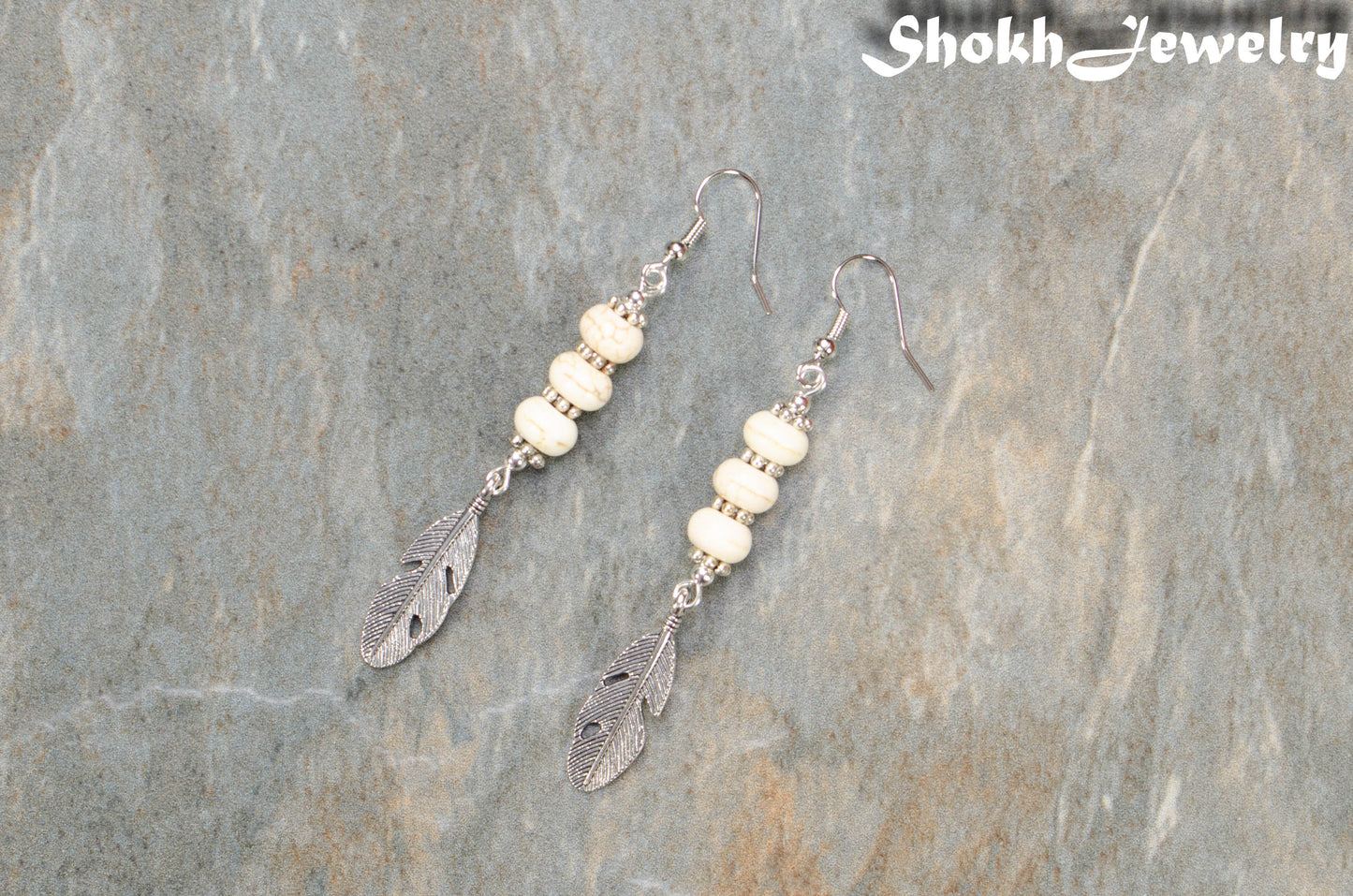 Top View of Statement White Howlite And Tibetan Silver Feather Earrings.