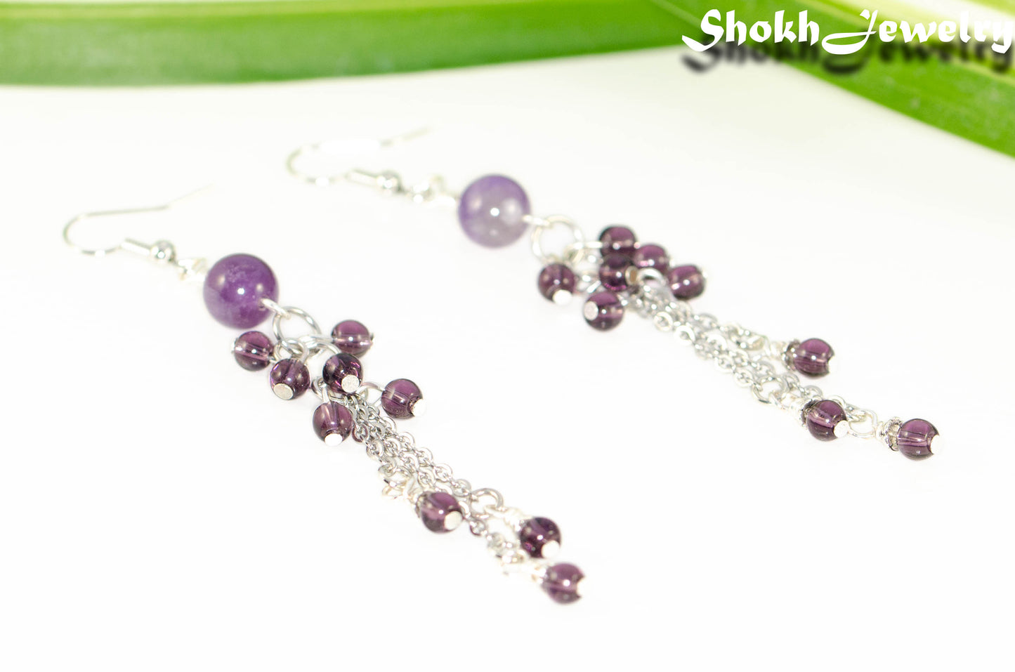Close up of Long Stainless Steel Chain and Amethyst Earrings.