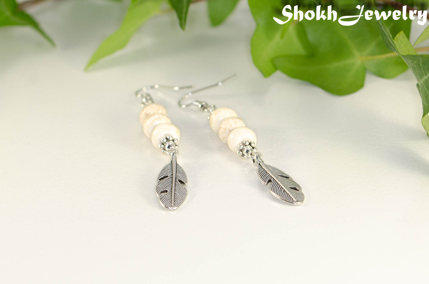 Statement White Howlite And Tibetan Silver Feather Earrings.