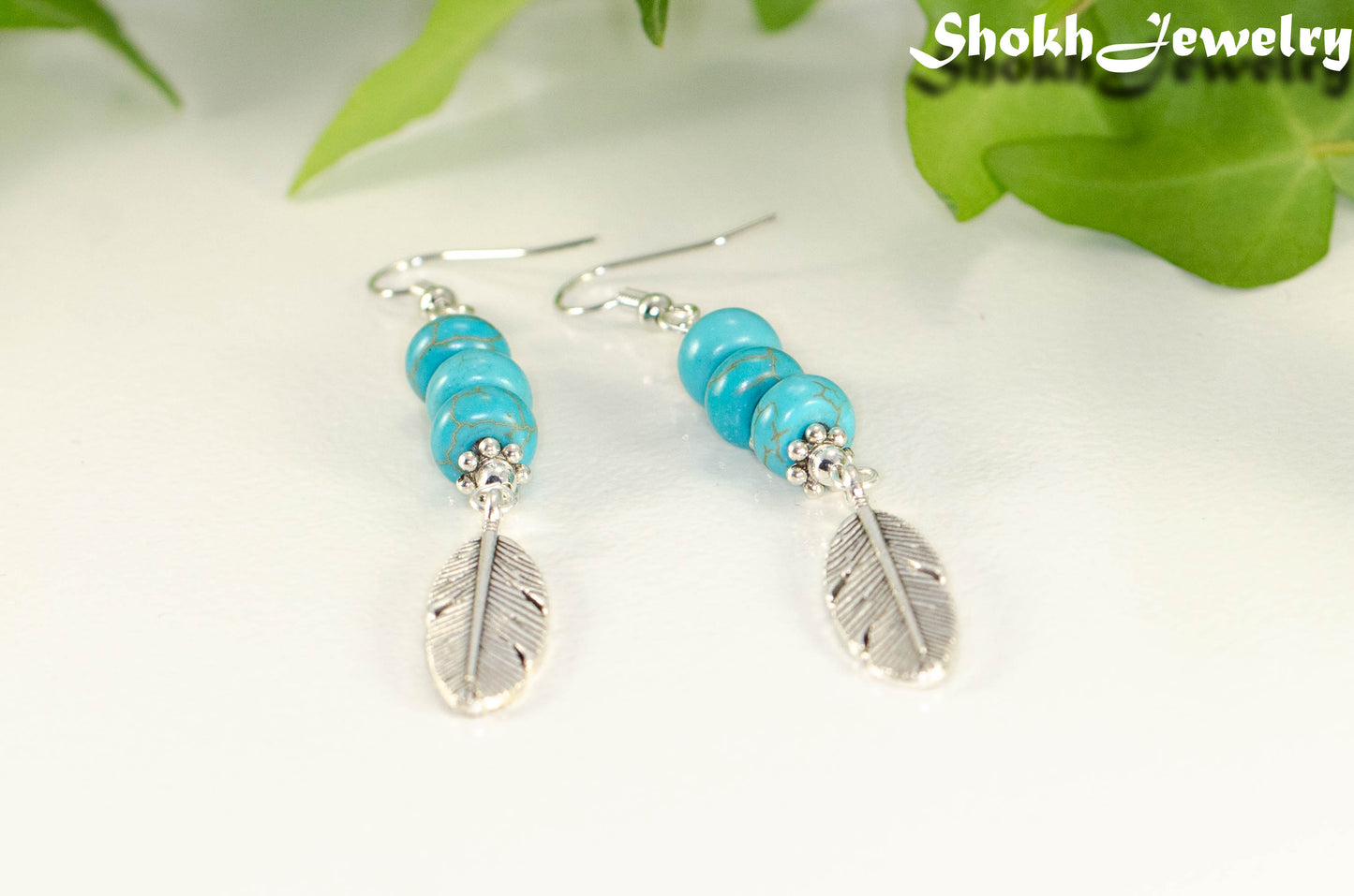 Statement Tibetan Silver Feather And Turquoise Howlite Earrings.