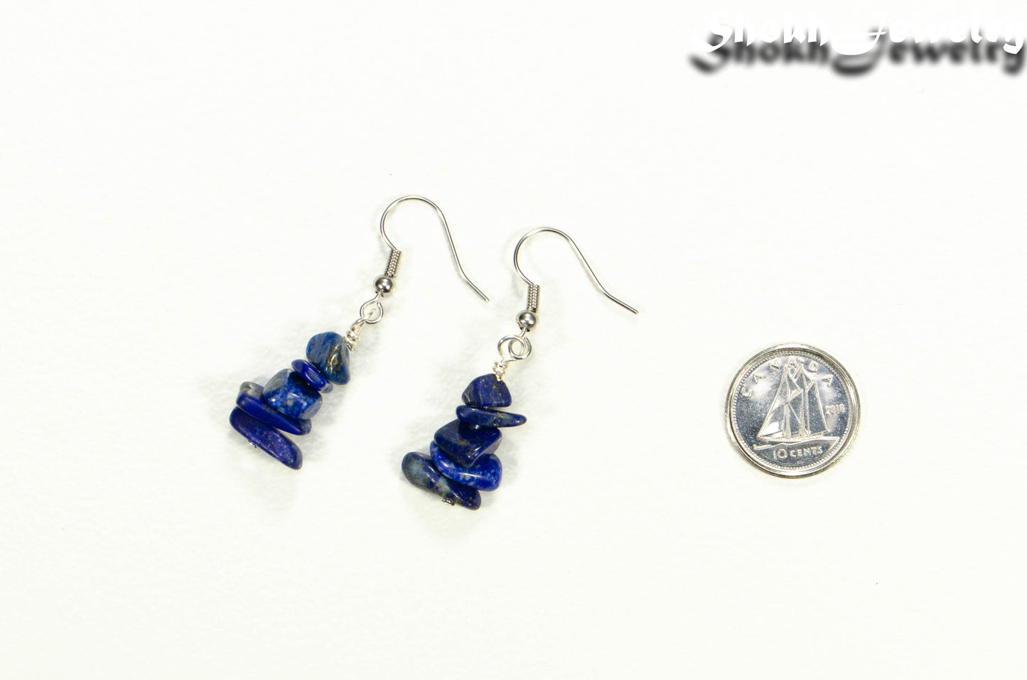 Simple Lapis Lazuli Crystal Chip Earrings beside a dime.