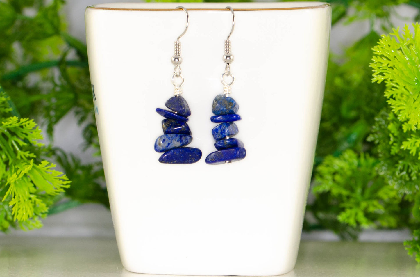 Simple Lapis Lazuli Crystal Chip Earrings displayed on a tea cup.