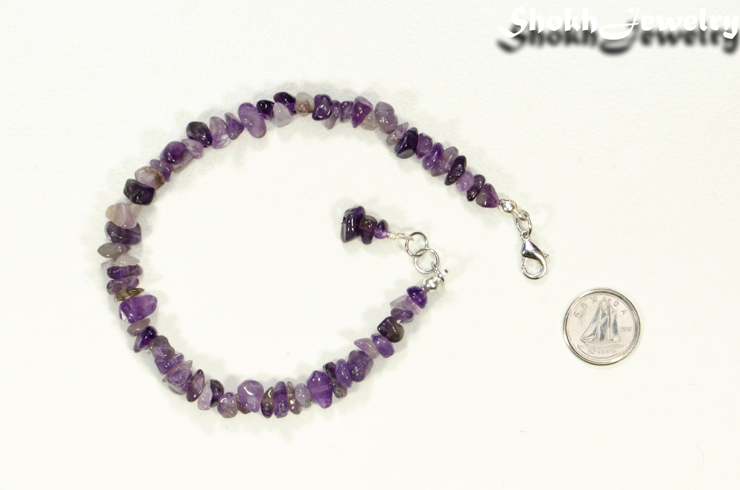 Natural Amethyst Crystal Chip Anklet beside a dime