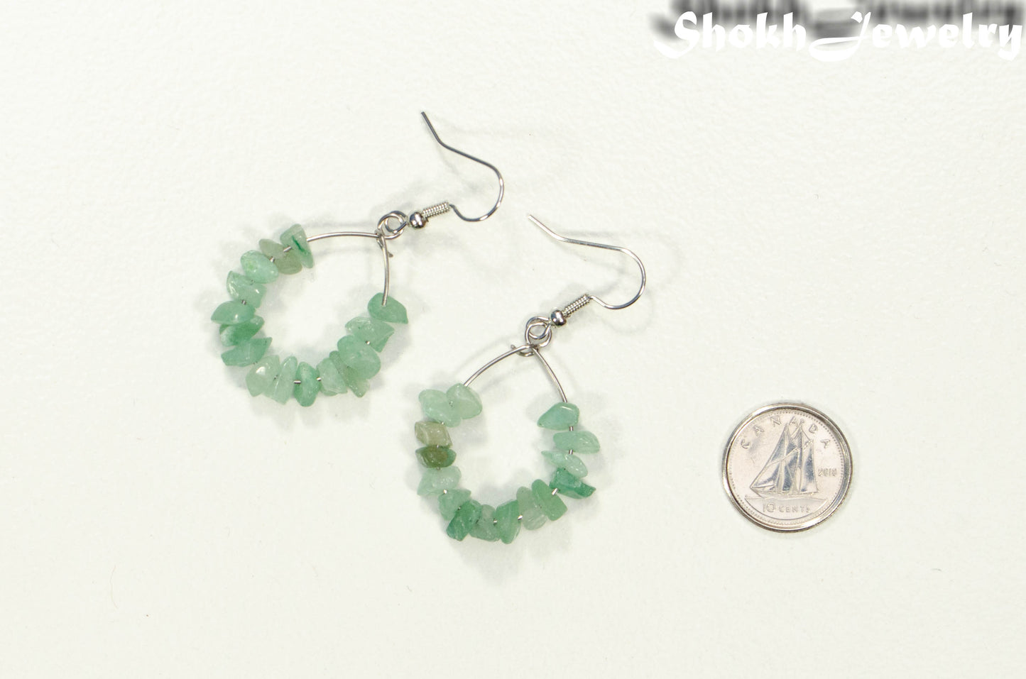 Natural Green Aventurine Crystal Chip Earrings beside a dime