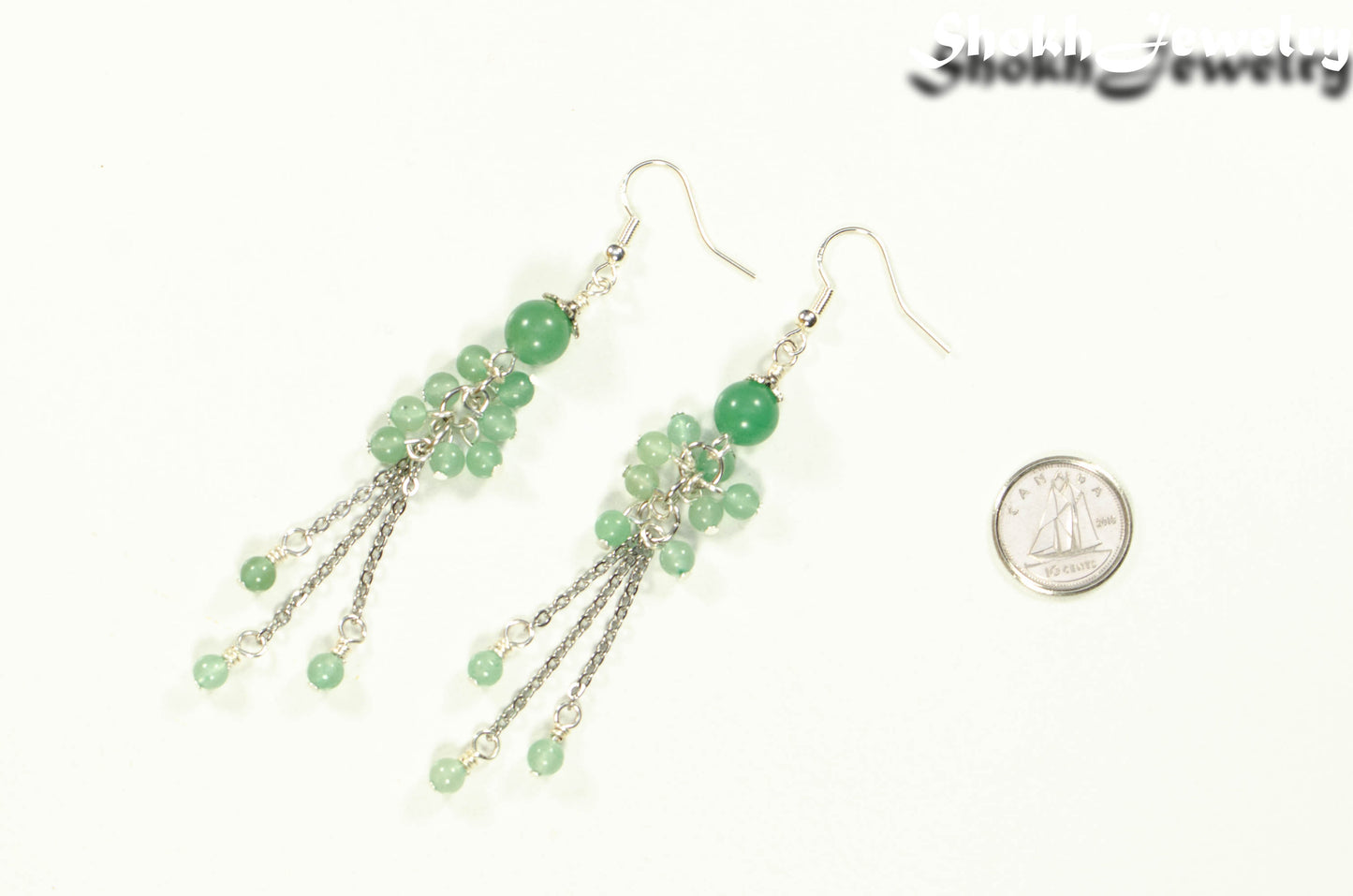 Long Stainless Steel Chain and Green Aventurine Earrings beside a dime.