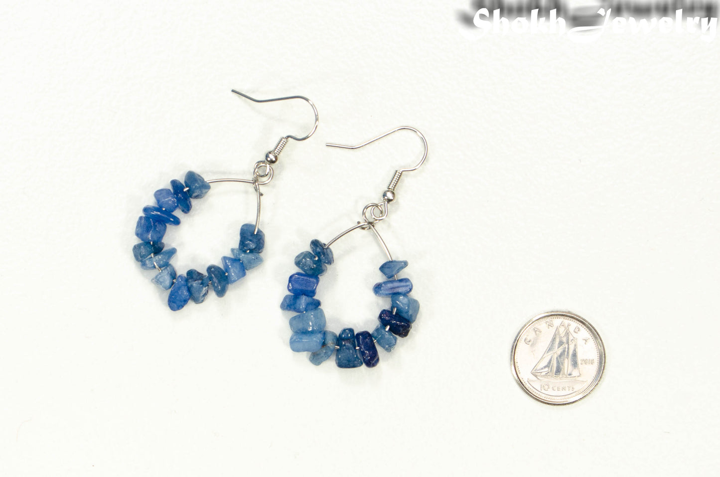 Natural Blue Quartzite Crystal Chip Earrings beside a dime
