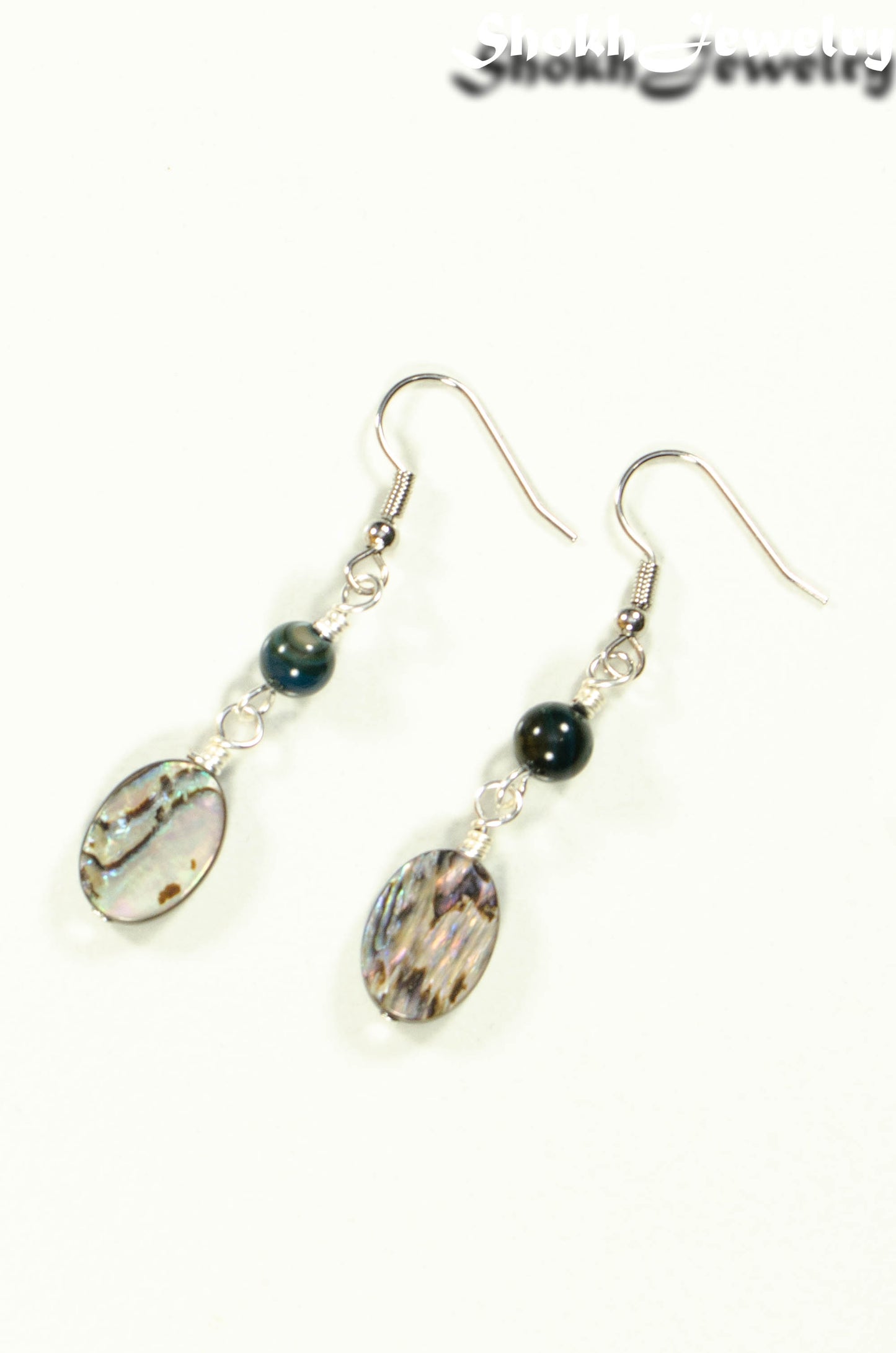 Top view of Long Oval Abalone Shell Earrings.