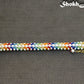Top view of Rainbow seed bead and pearl woven bracelet.