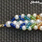 Rainbow seed bead and pearl woven bracelet with clasp.