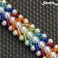Close up of Rainbow seed bead and pearl woven bracelet.