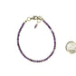 3mm Amethyst Bracelet with Clasp beside a dime.