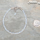 3mm Clear White Opalite Anklet beside a dime.