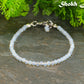 3mm Clear White Opalite Anklet on a stone surface.