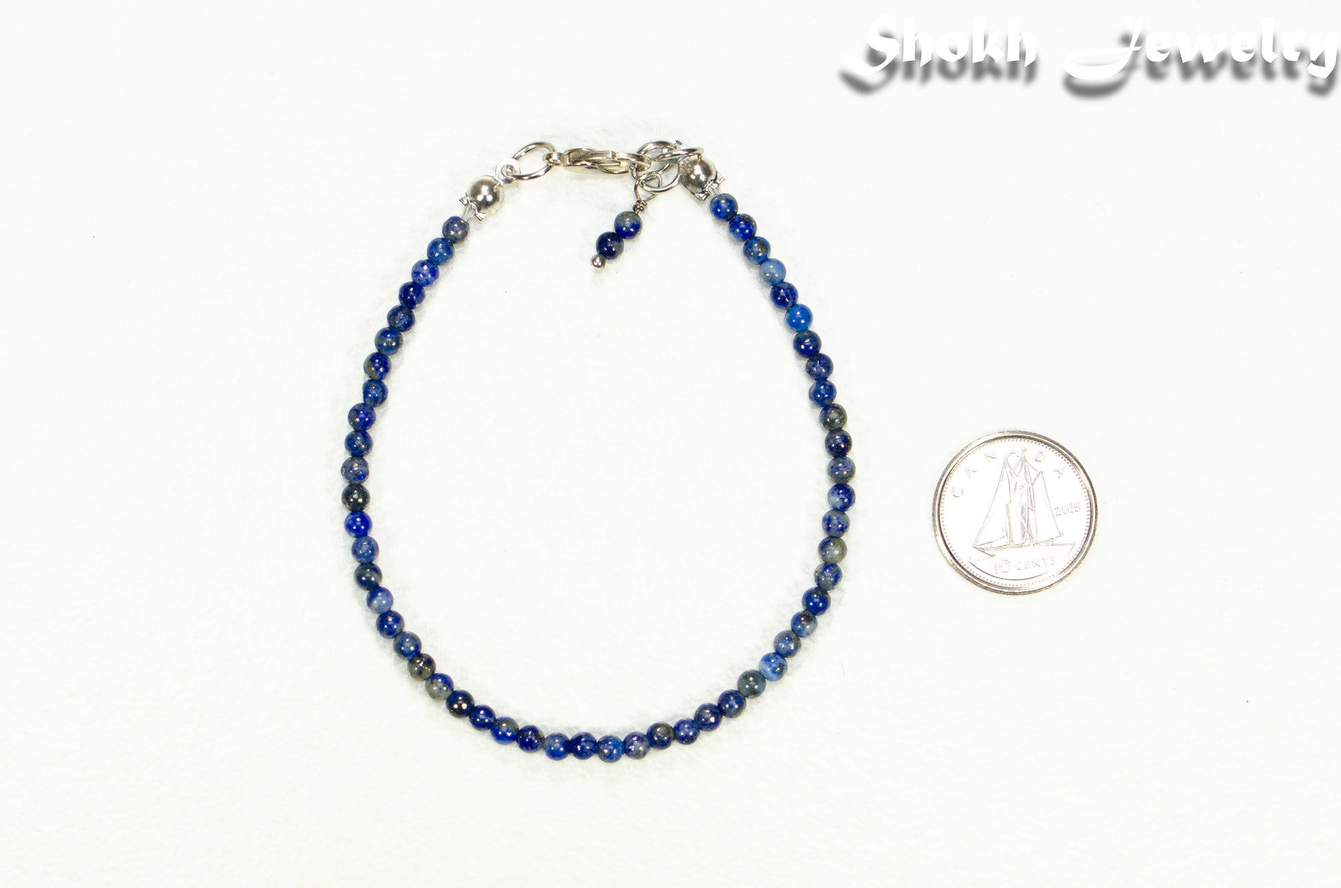 3mm Lapis Lazuli Anklet beside a dime.