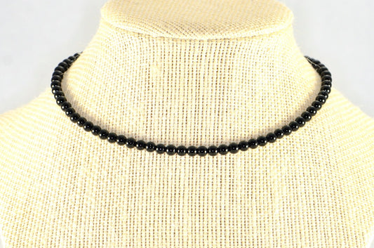 4mm Black Obsidian Crystal Choker Necklace displayed on a bust.