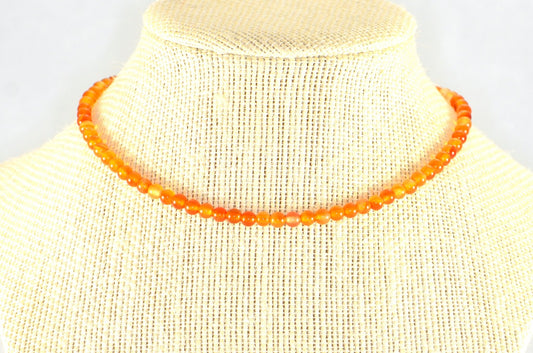 4mm Carnelian Crystal Choker Necklace displayed on a bust.