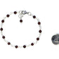 4mm Garnet Link Bracelet beside a dime.