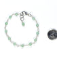 4mm Green Aventurine Link Bracelet beside a dime.