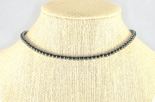 4mm Natural Hematite Choker Necklace displayed on a bust.