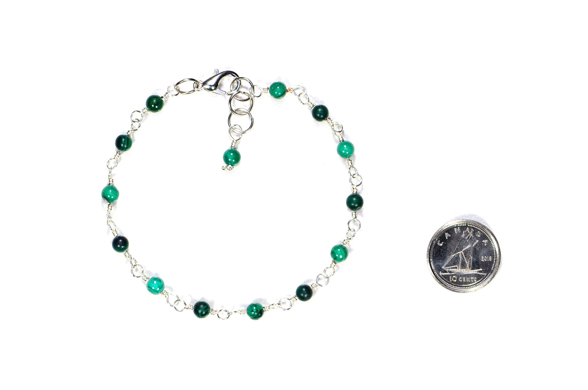 4mm Natural Malachite Link Bracelet beside a dime.