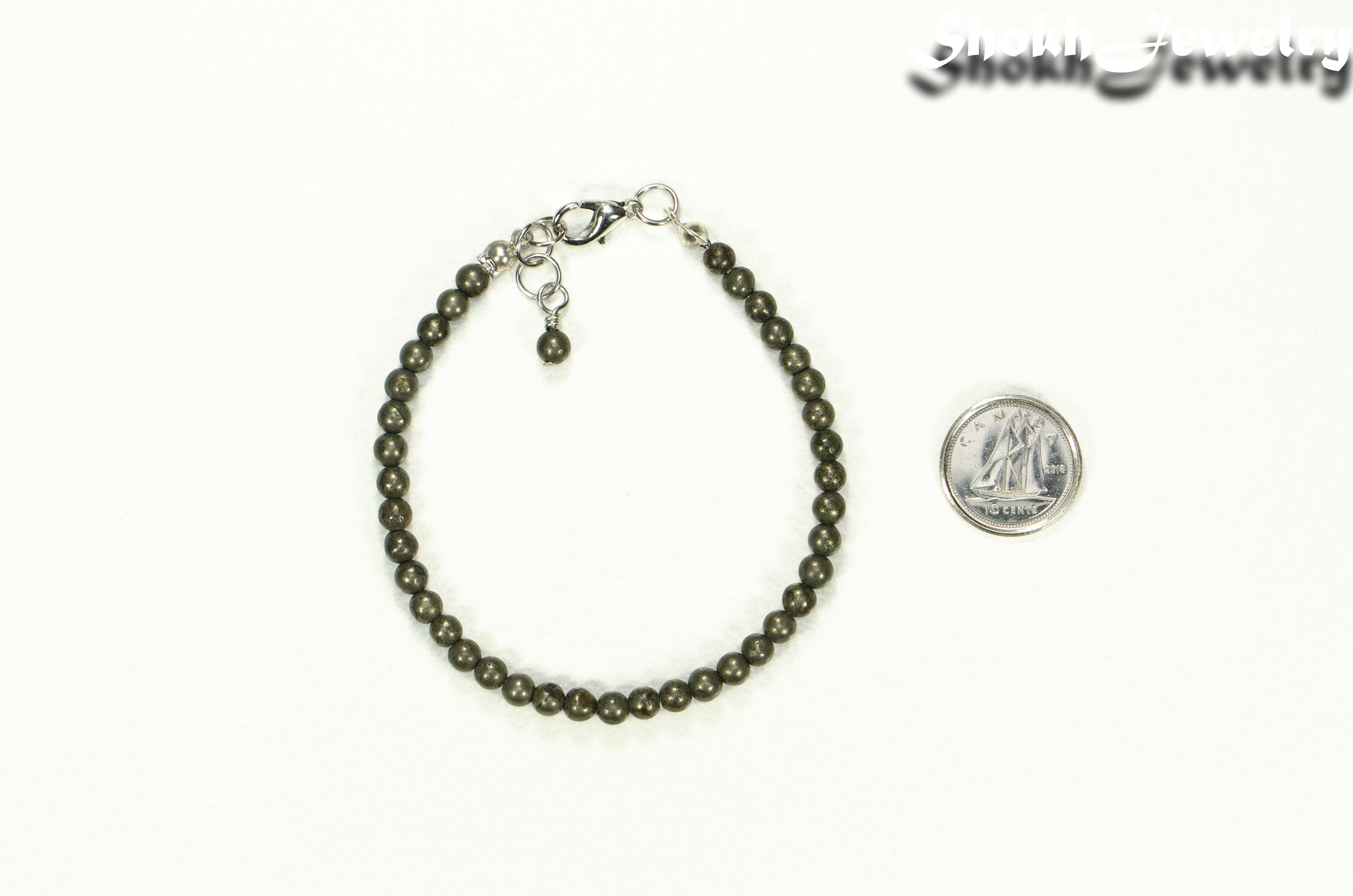 4mm Natural Pyrite anklet with Clasp beside a dime.