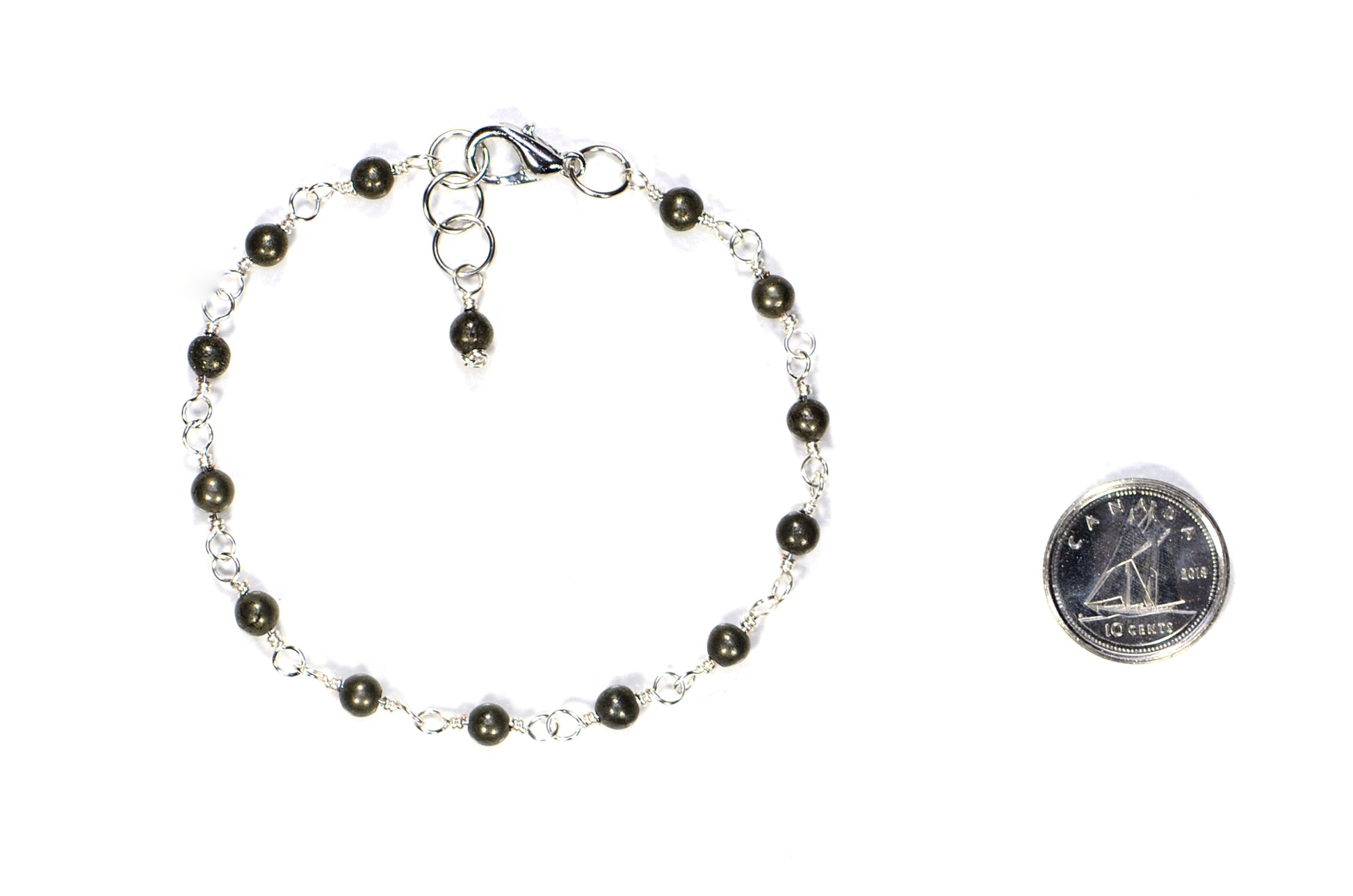 4mm Natural Pyrite Link Bracelet beside a dime.