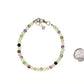 4mm Natural Rainbow Fluorite Bracelet with Clasp beside a dime.