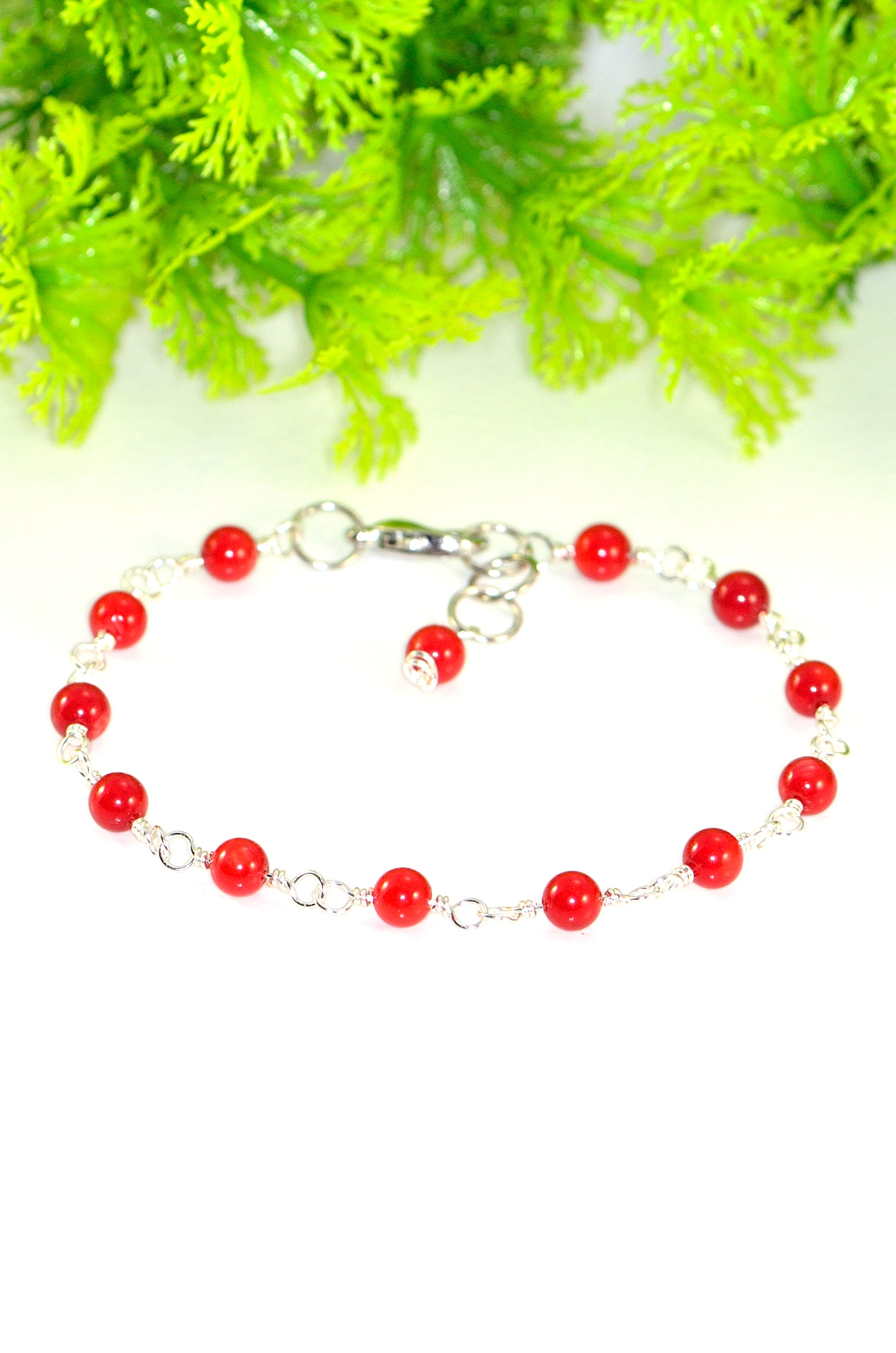 Close up of 4mm Natural Red Dyed Coral Link Bracelet.