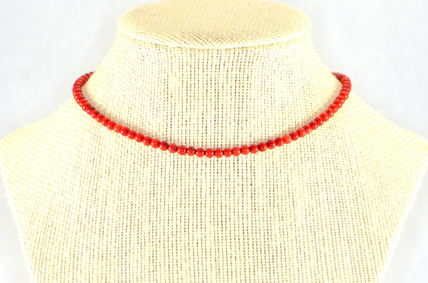 4mm Red Dyed Natural Coral Choker Necklace displayed on a bust.