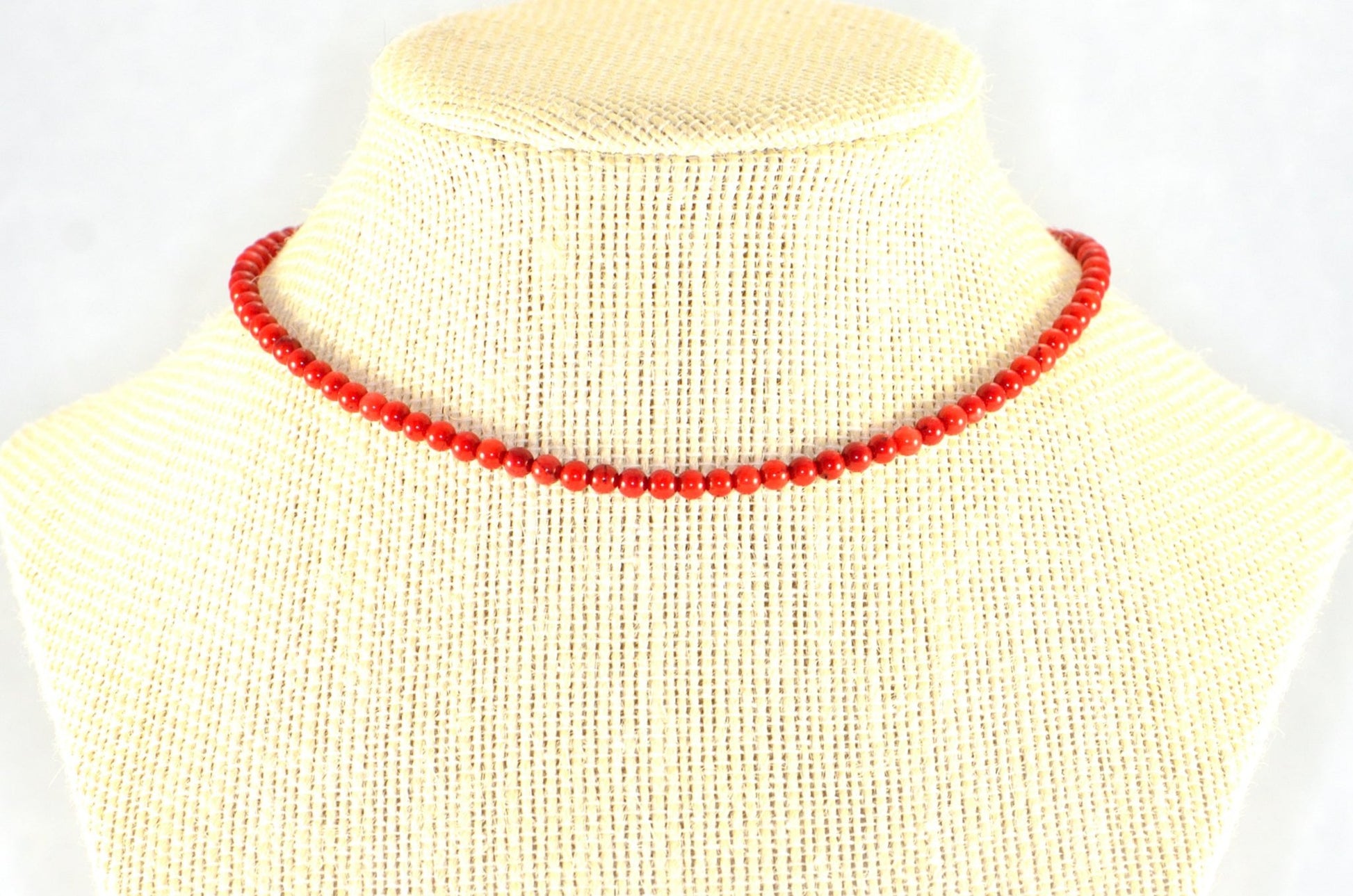 4mm Red Dyed Natural Coral Choker Necklace displayed on a bust.