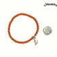 4mm Red Jasper Bracelet with Initial  beside a dime.