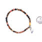 4mm Rhodonite Bracelet with Initial beside a dime.