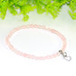 Close up of 4mm Rose Quartz Bracelet with Heart Charm.