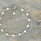 4mm Rose Quartz Link Bracelet beside a dime.