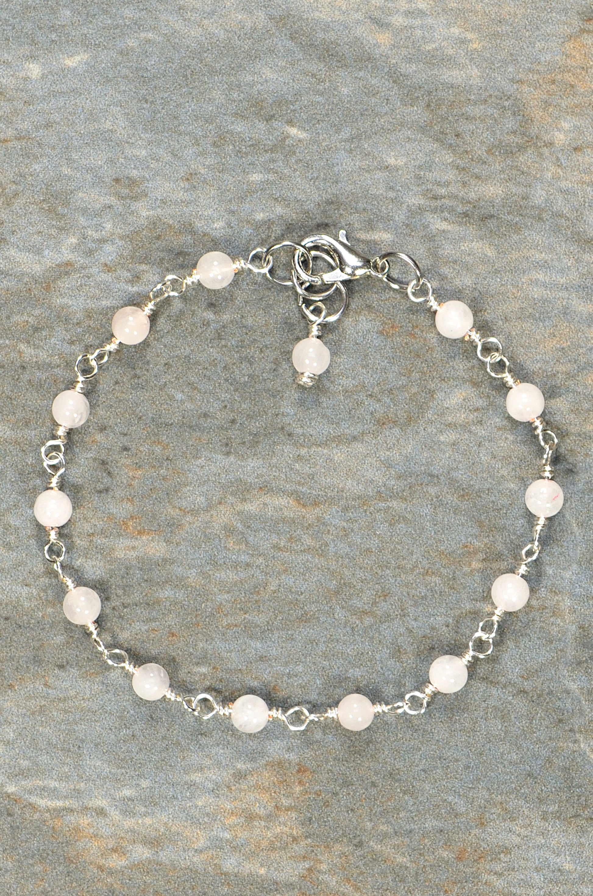 Top view of 4mm Rose Quartz Link Bracelet.
