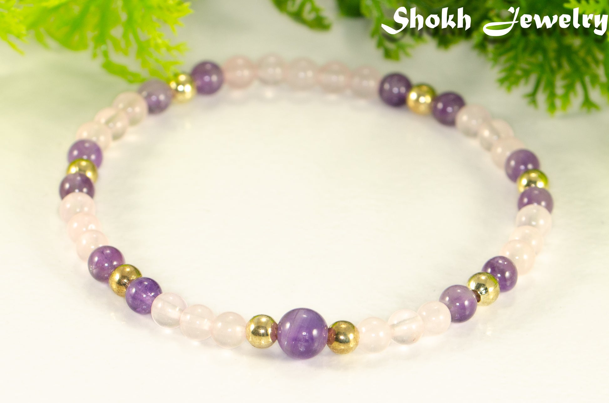 Close up of 4mm Rose Quartz and Amethyst Bracelet.
