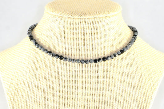 4mm Snowflake Obsidian Crystal Choker Necklace displayed on a bust.