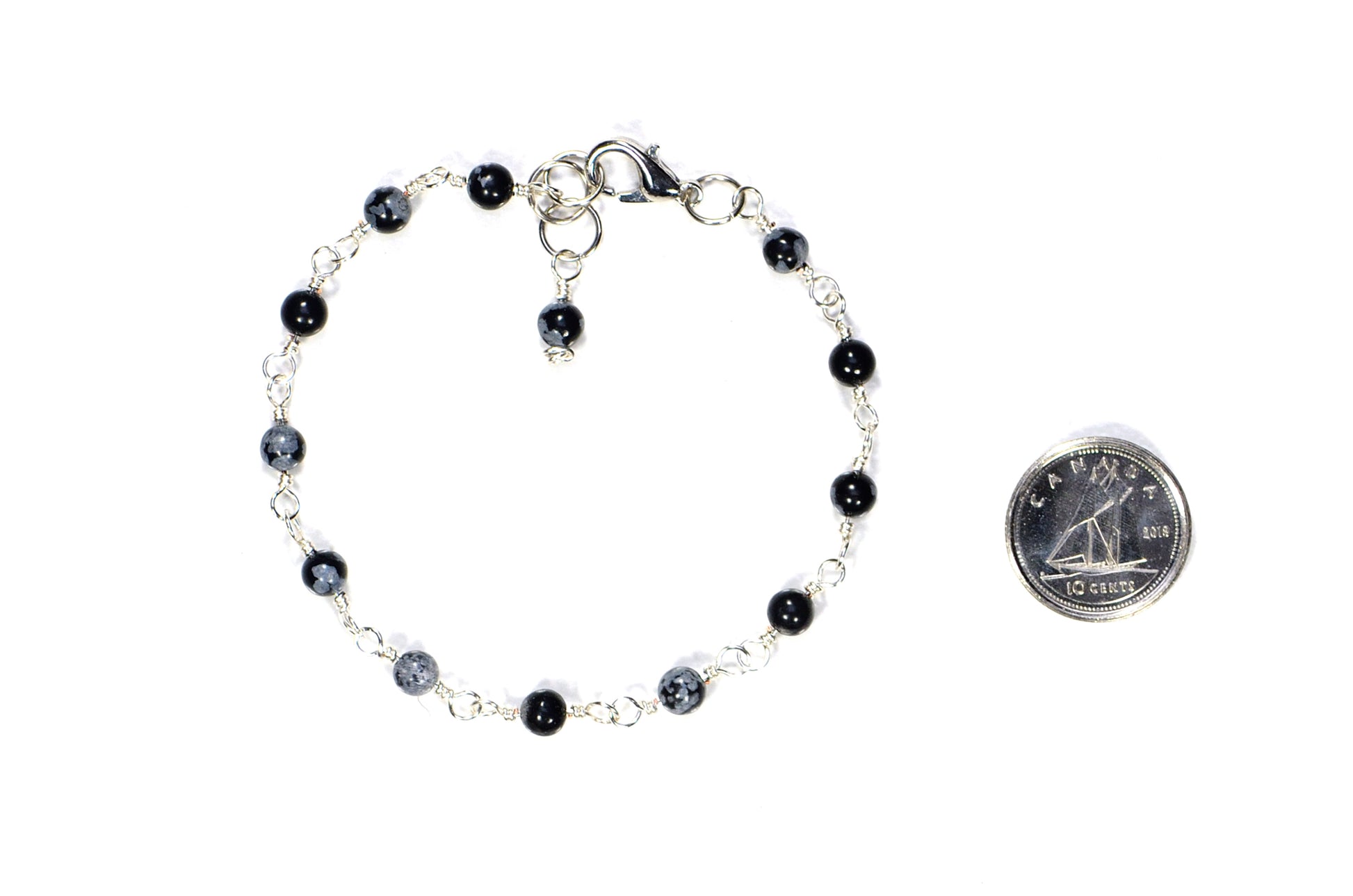 4mm Snowflake Obsidian Link Chain Bracelet beside a dime.