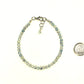 4mm Sparkly Selenite Bracelet with Clasp beside a dime.