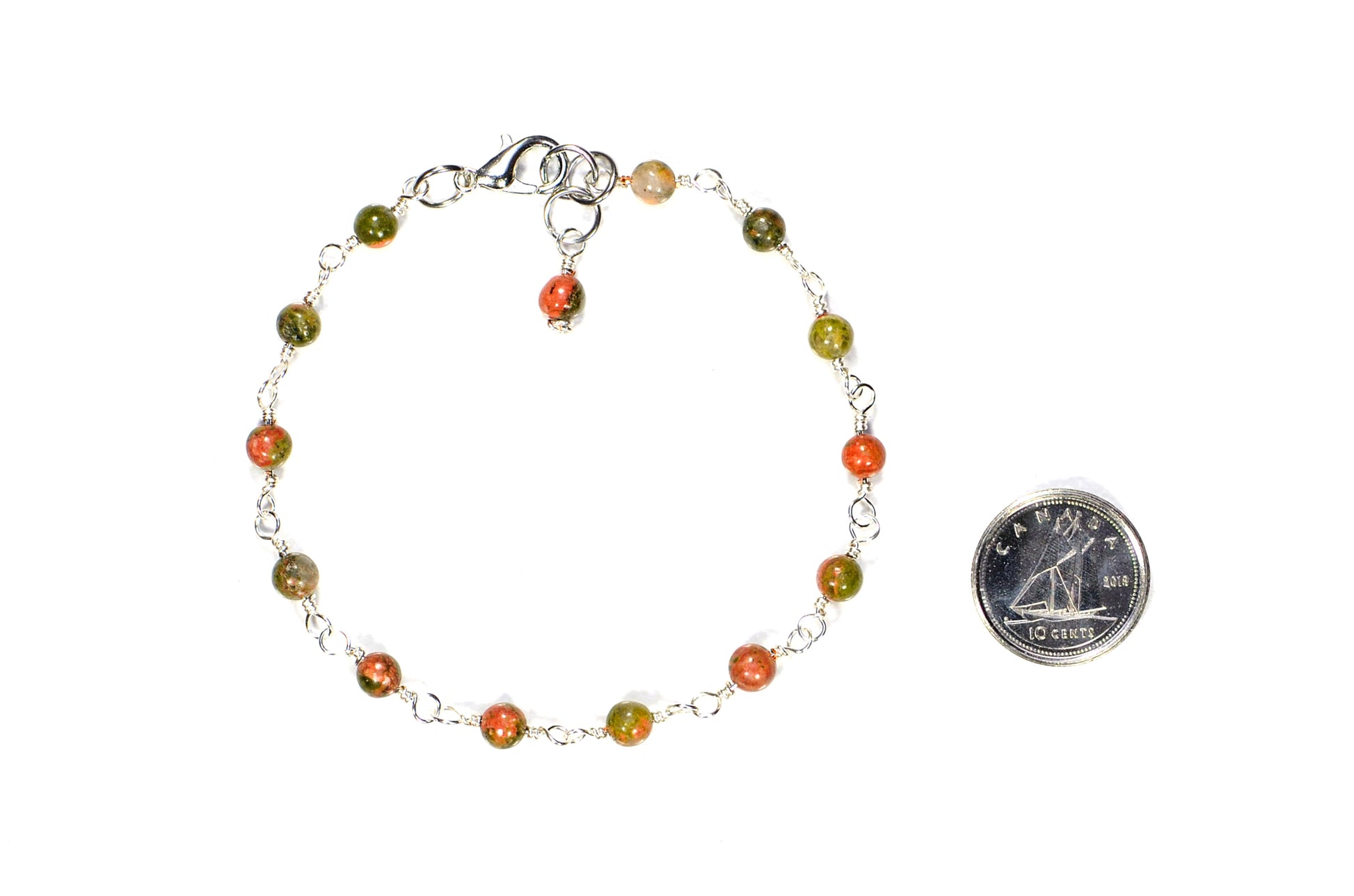 4mm Unakite Jasper Link Bracelet beside a dime.