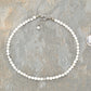4mm White Howlite Choker Necklace beside a dime.