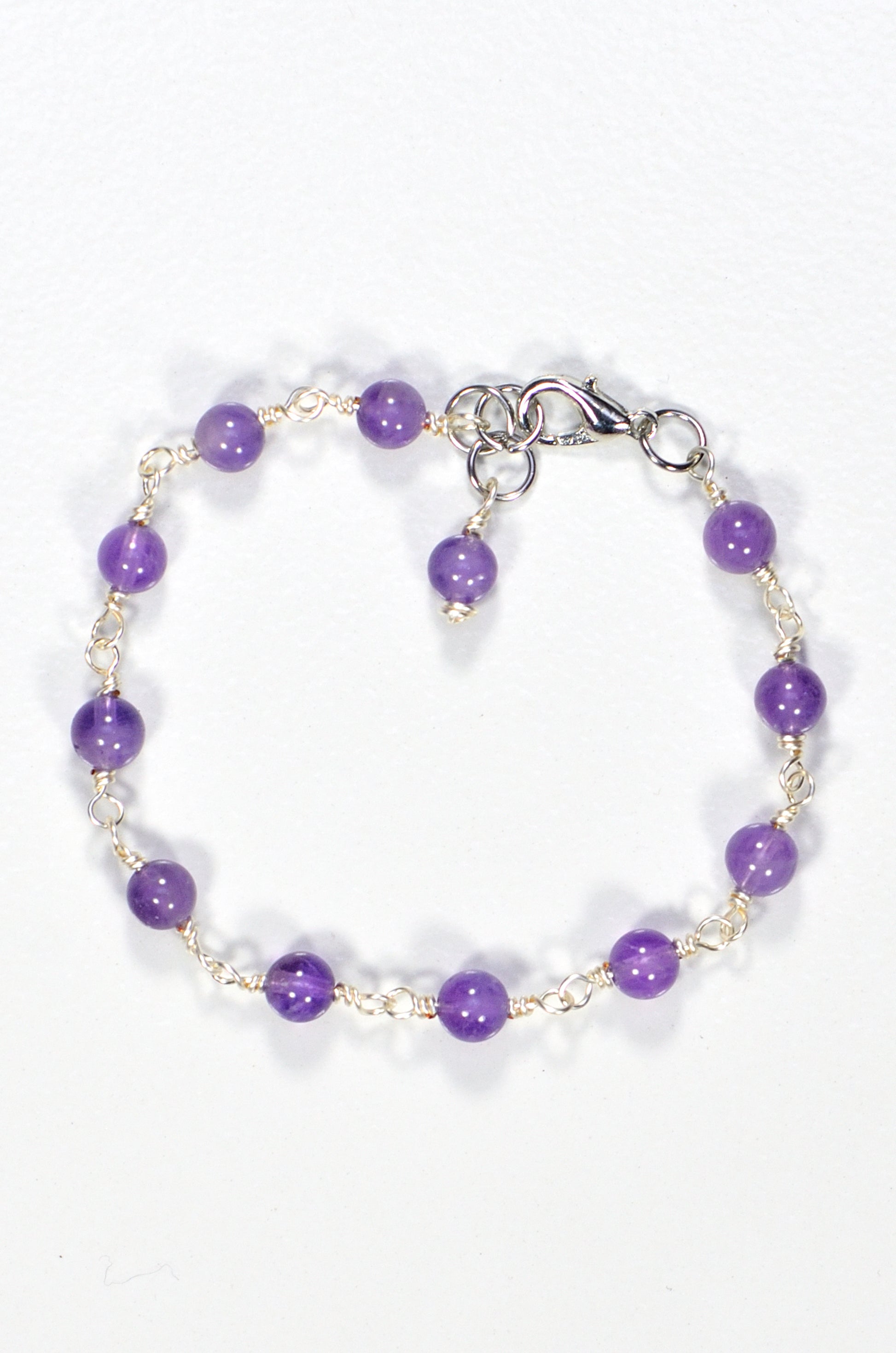 Top view of 6mm Amethyst Link Bracelet.