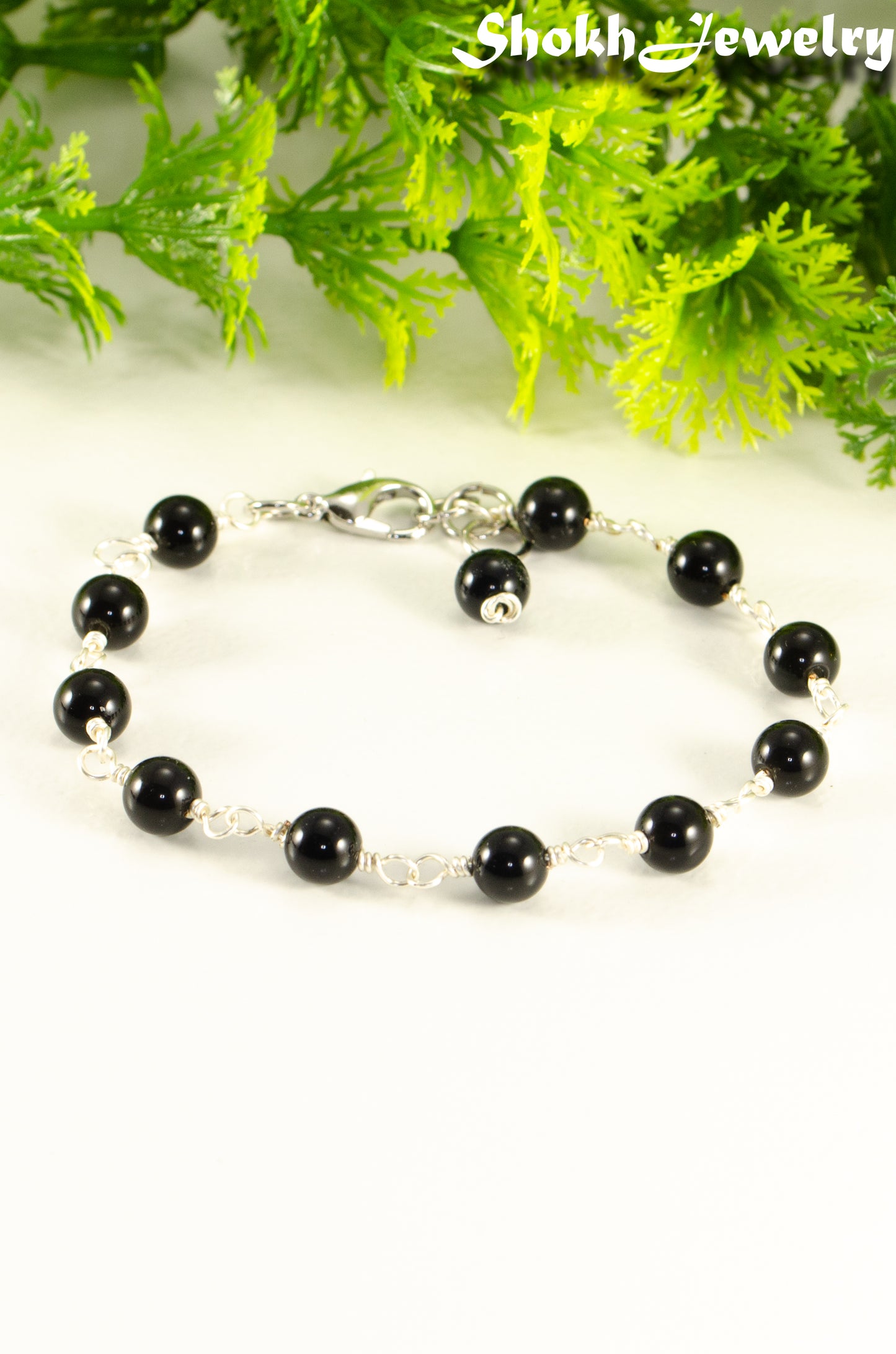 Close up of 6mm Black Obsidian Link Chain anklet.