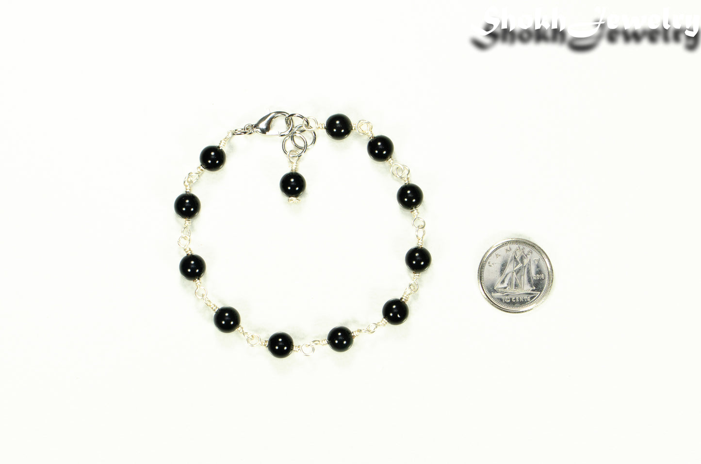 6mm Black Obsidian Link Chain anklet beside a dime.