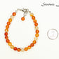 6mm Carnelian Crystal Bracelet beside a dime.