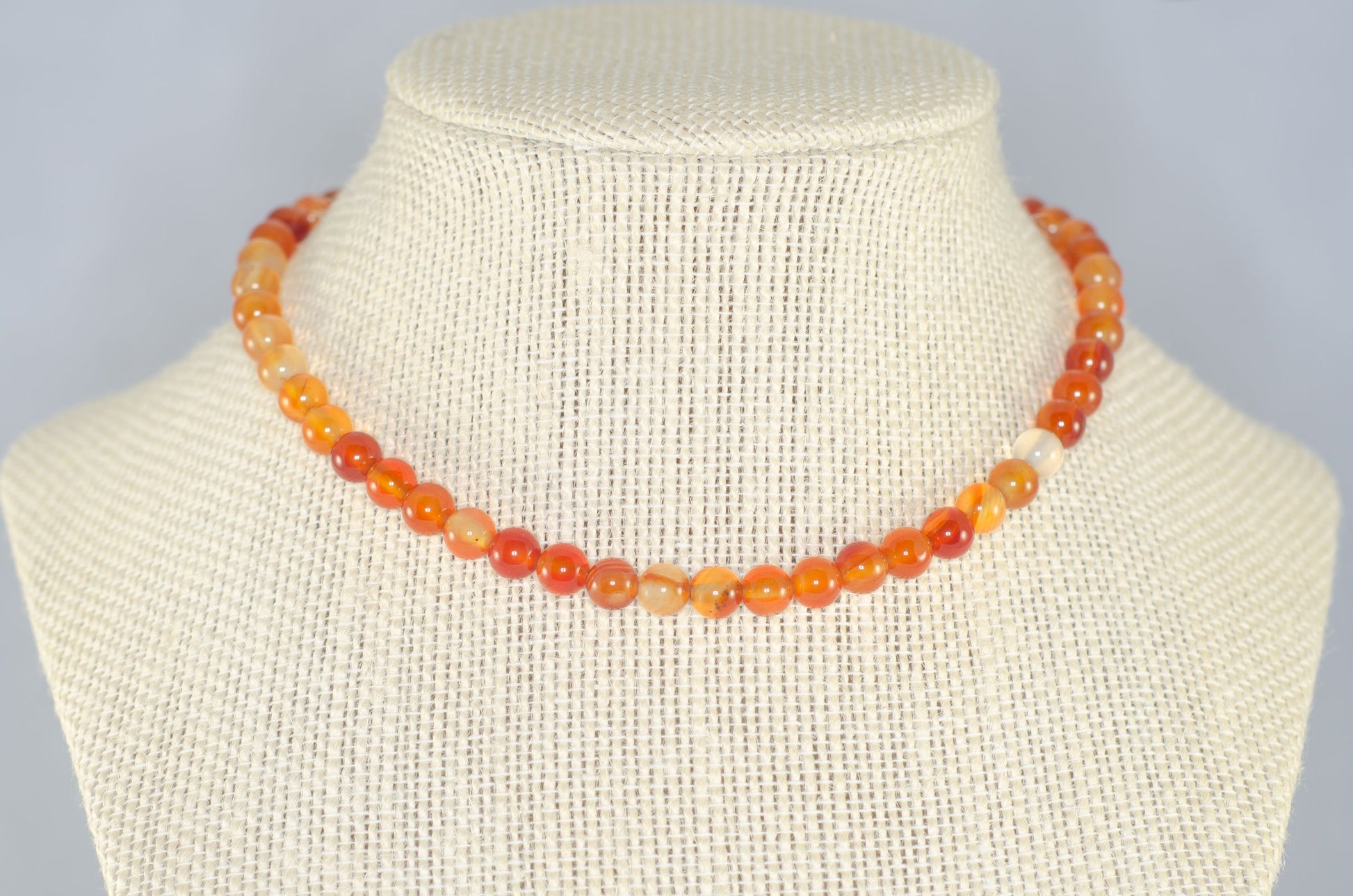 6mm Carnelian Crystal Choker Necklace displayed on a bust.
